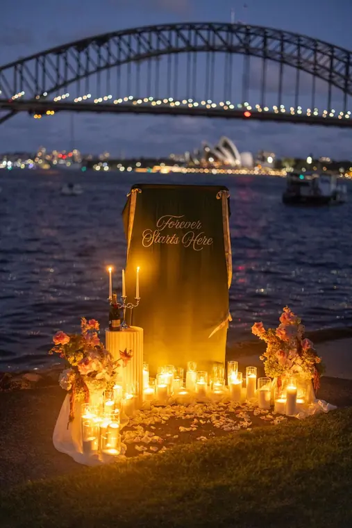 Proposal setup with candles and florals by the harbour